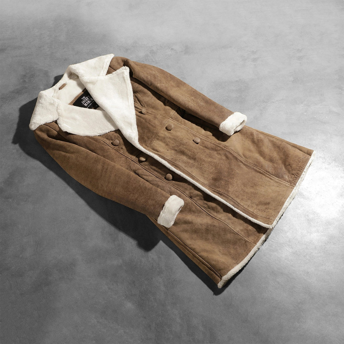 
Open Hem & Hem Craftsmanship Construction Detail on Amie Distressed Brown Double Breasted Shearling Coat