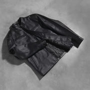 Styled Fit Perspective of Austere Matte Negro Chaqueta Biker de Cuero para Hombre on Model - Natural Daylight Drape