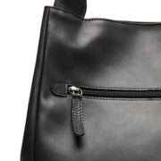 Fioline Full-Grain Leather Handbag - Vista de perfil lateral con corte ergonómico de manga