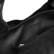 Tenara Full-Grain Leather Handbag para Mujer - Vista de perfil lateral con corte ergonómico de manga