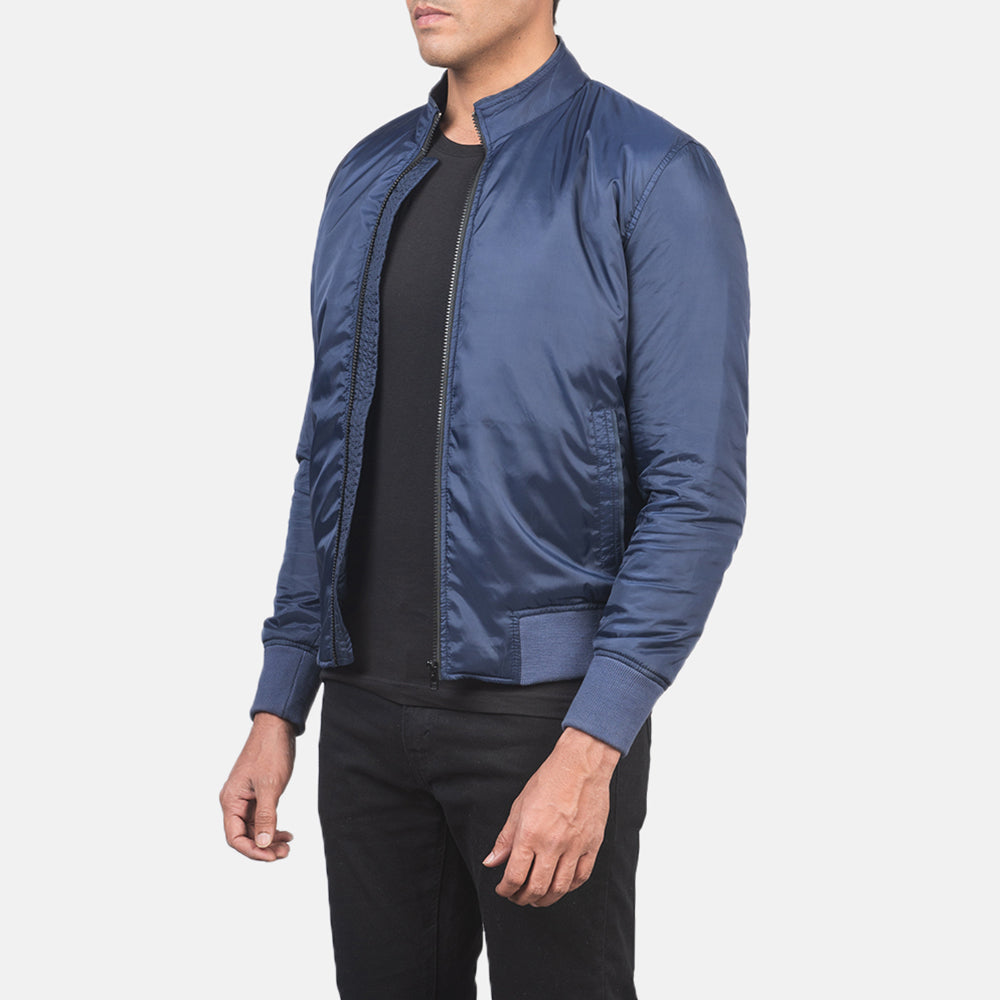 
Blue Nylon Bomber Jacket - Vista posterior con hombros definidos y bajo impecable