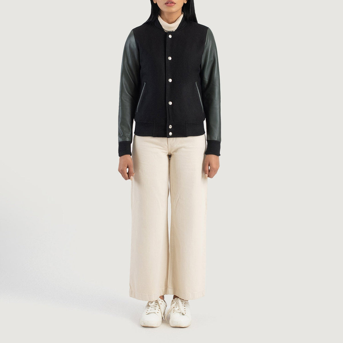 Savant Green Hybrid Varsity Jacket - Vista de perfil lateral con corte ergonómico de manga